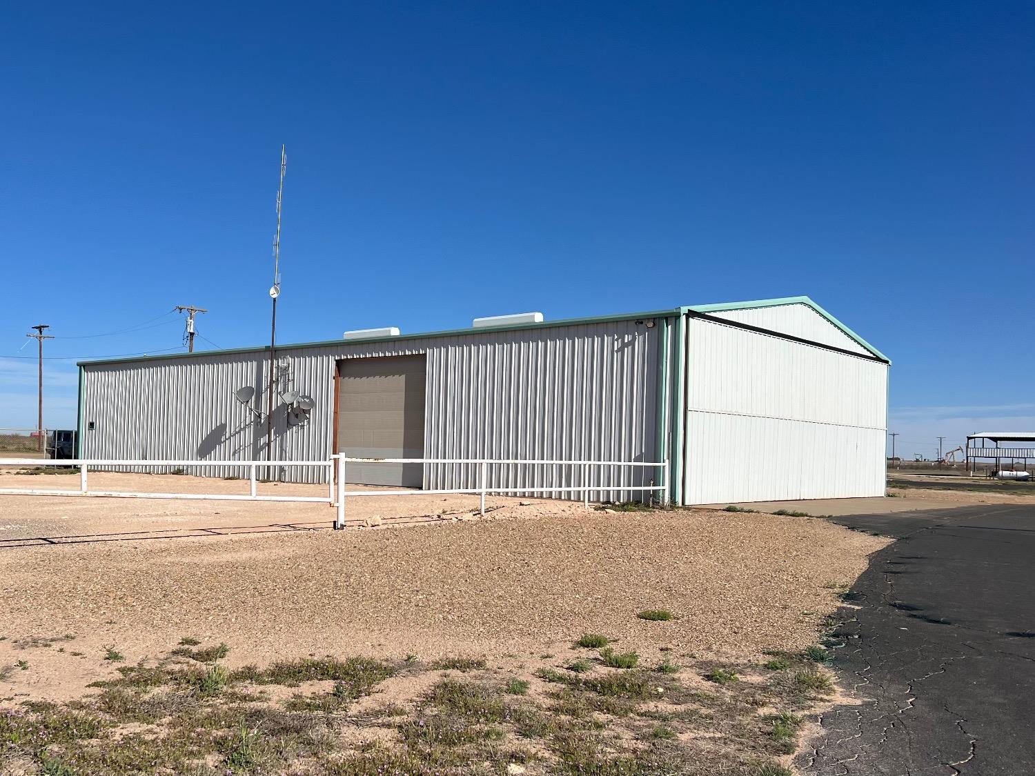 Amazing opportunity to own an Airplane hangar at the Yoakum County Airport. This Commercial Aircraft Hangar comes with Pilot's Lounge, two Private Offices, Pilot's Quarters with 3 bedrooms, living room, laundry room, 3 bathrooms and a kitchen.