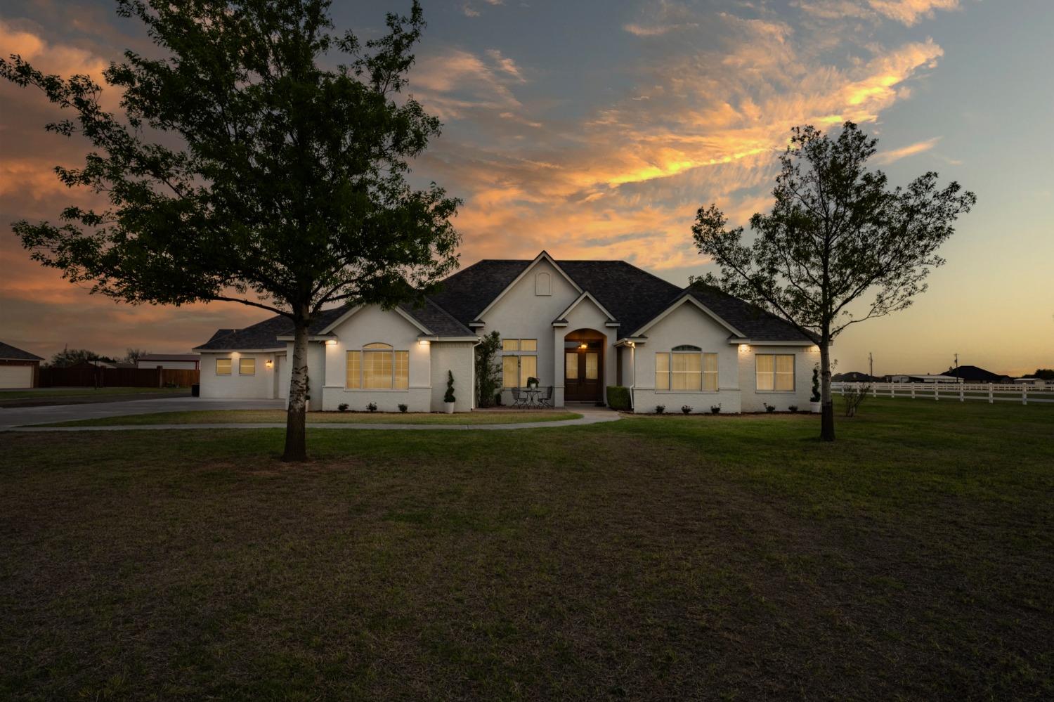 Are you looking for your own piece of West Texas? This beautiful 5/3.5/3 + basement in Saddle Club allows horses and has so many extras! Seated on 2+ acres with established trees and landscaping, the home has great curb appeal. Inside you'll find a well-designed floor plan with 2 living areas and an office flowing right into the dining room and kitchen. The kitchen is a chef's dream with beautiful custom cabinetry, a large island with bar seating, and quartz counters. The isolated primary suite features a bonus space leading into the room as well as a walk-in shower, double sinks and dual closets. The other bedrooms offer ample space for guests or a growing family. The backyard is a true oasis with gorgeous sunset views featuring a large covered patio, a luxurious pool and hot tub, a children's play area, and a sand volleyball pit. The home also features a 40x60 insulated shop with an office and full bathroom as well as RV hookups. Schedule a private showing today!
