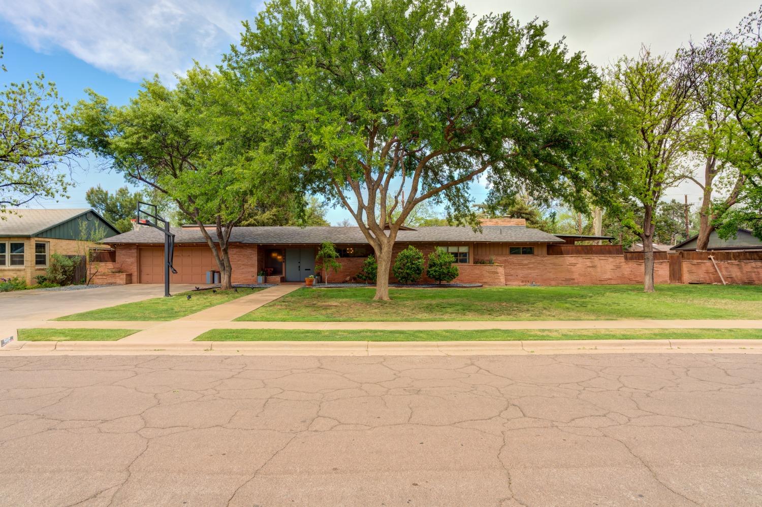 Situated in the highly sought-after Tech Terrace Area and within the coveted Roscoe-Wilson Elementary District, it offers both a prime location and excellent schooling options. With its spacious layout spread across two lots, it's not just a home; it's a masterpiece of mid-century architecture. The combination of ample space, architectural integrity, and desirable location makes it a rare find.With its large, open spaces, two gorgeous fireplaces, and custom-built bar, it's perfectly designed for hosting gatherings and creating memorable moments with friends and family. The original St. Charles kitchen with a custom island adds a touch of vintage charm and practicality, offering both style and functionality. Conveniently located close to two parks, pizza joint, and coffee shop makes this home the most highly desirable home!
