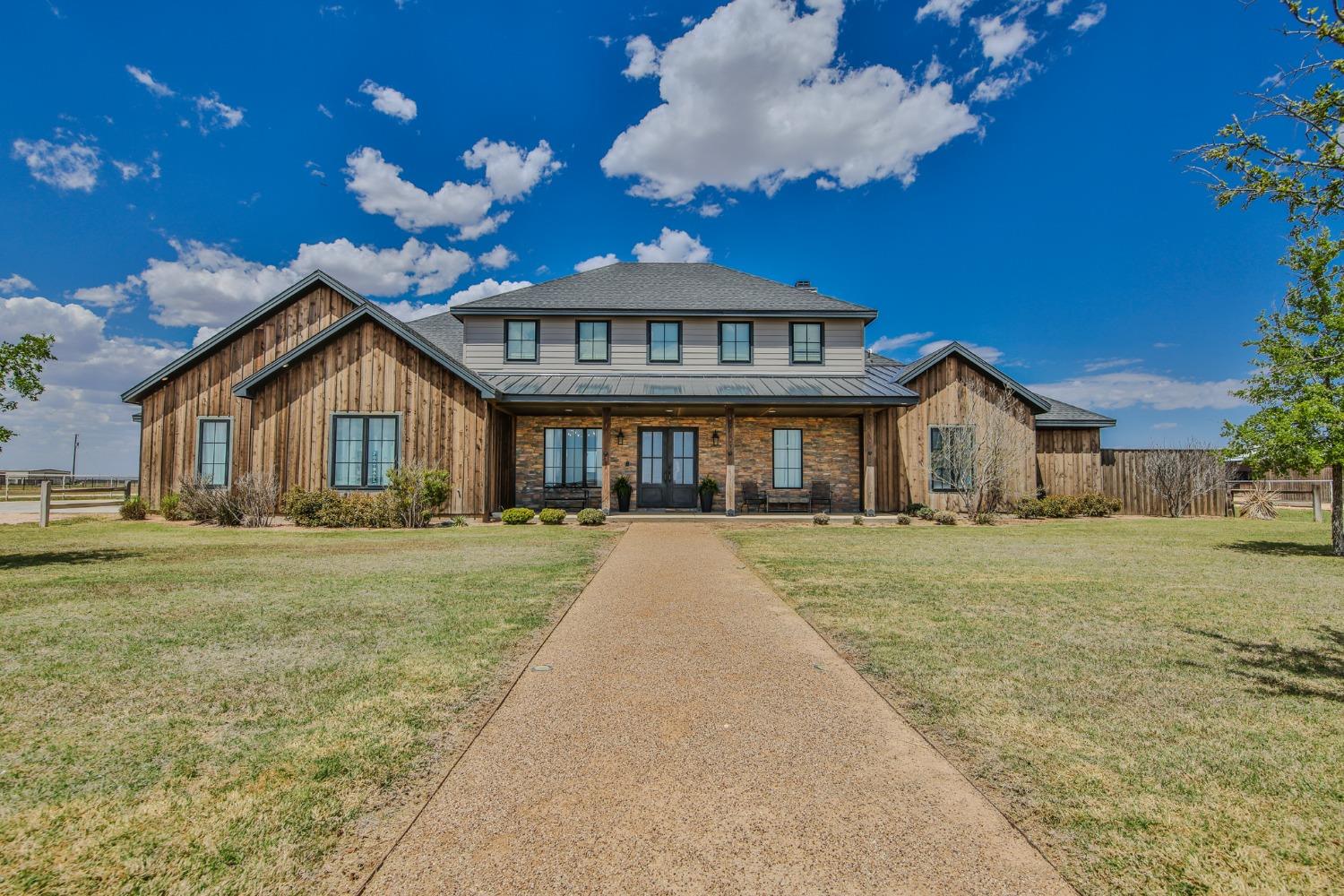 This Beautifully crafted custom home with a separate GUEST HOUSE sits on a 1-acre lot in New Home, TX and just 10 minutes from Lubbock! The main house, 3,226 square feet, consists of 3 large bedrooms, 3.5 bathrooms, a large bonus space/loft, a 23 foot vaulted ceiling in the living room, a separate office space, and an isolated master suite. The master suite offers separate vanities, a jetted tub, and a huge walk-in closet. The kitchen includes a gas stove, ice maker and built in double fridge along with a large pantry. In addition, the guest house has it's own separate entrances from the back porch and by it's own 1 car garage. It is 1,546 square feet, offers 2 bedrooms, 2 bathrooms, a full kitchen and a wheelchair accessible master suite. Enjoy the huge patio in the evenings shielded from the sunsets in the West. You'll find a dog run on the east side of the home as well. A rare find with a true guest house And/OR great mother in law suite. This house is like buying two homes in one!
